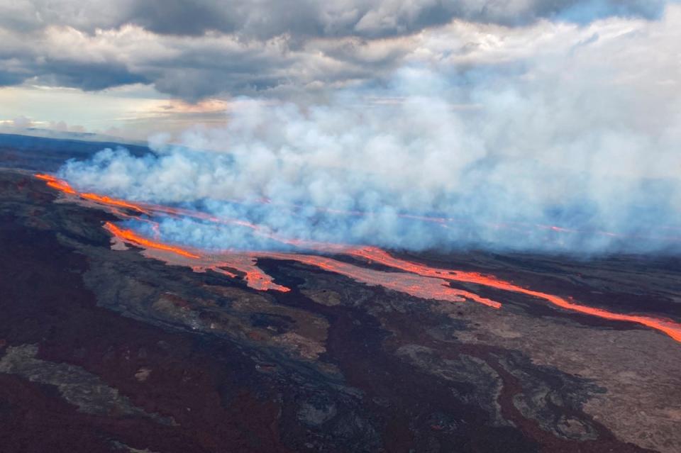 In this aerial photo released by the US Geological Survey, the Mauna Loa volcano is seen erupting from vents on the Northeast Rift Zone on the Big Island of Hawaii, on Monday ((U.S. Geological Survey via AP))