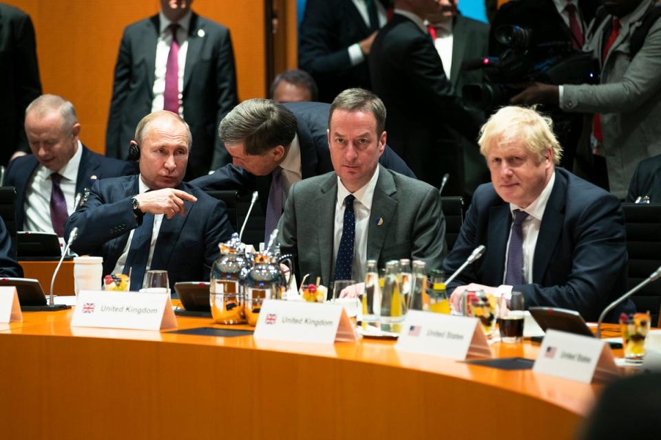 Boris Johnson (R) and Russian President Vladimir Putin (2L) are pictured before the beginning of the meeting at the Chancellery on January 19, 2020 in Berlin, Germany (Getty Images)