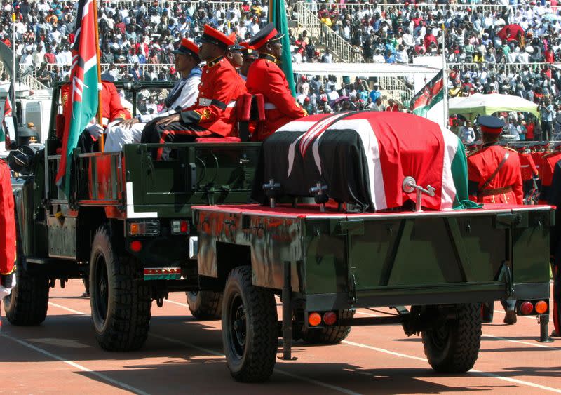 Military officers escort a gun carriage carrying the coffin of late former Kenya's President Daniel Arap Moi, draped in the national flag, during a state funeral procession to the Nyayo Stadium, the venue of the national memorial service in Nairobi