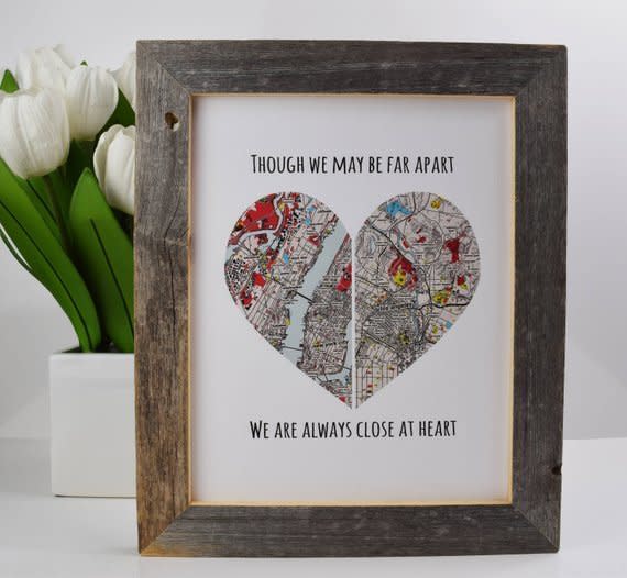 This beautifully framed, hand-crafted <strong><a href="https://www.etsy.com/listing/582668800/long-distance-friendship-long-distance?ref=related-1&amp;pro=1" target="_blank" rel="noopener noreferrer">heart print features two locations for you and your loved one</a></strong>. Designed and printed in California, this Etsy seller will even provide a proof before the picture is printed to ensure it meets your standard.