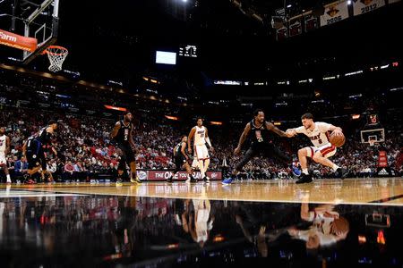 Jan 23, 2019; Miami, FL, USA; Miami Heat guard Tyler Johnson (8) dribbles the ball around LA Clippers guard Patrick Beverley (21) during the second half at American Airlines Arena. Mandatory Credit: Jasen Vinlove-USA TODAY Sports