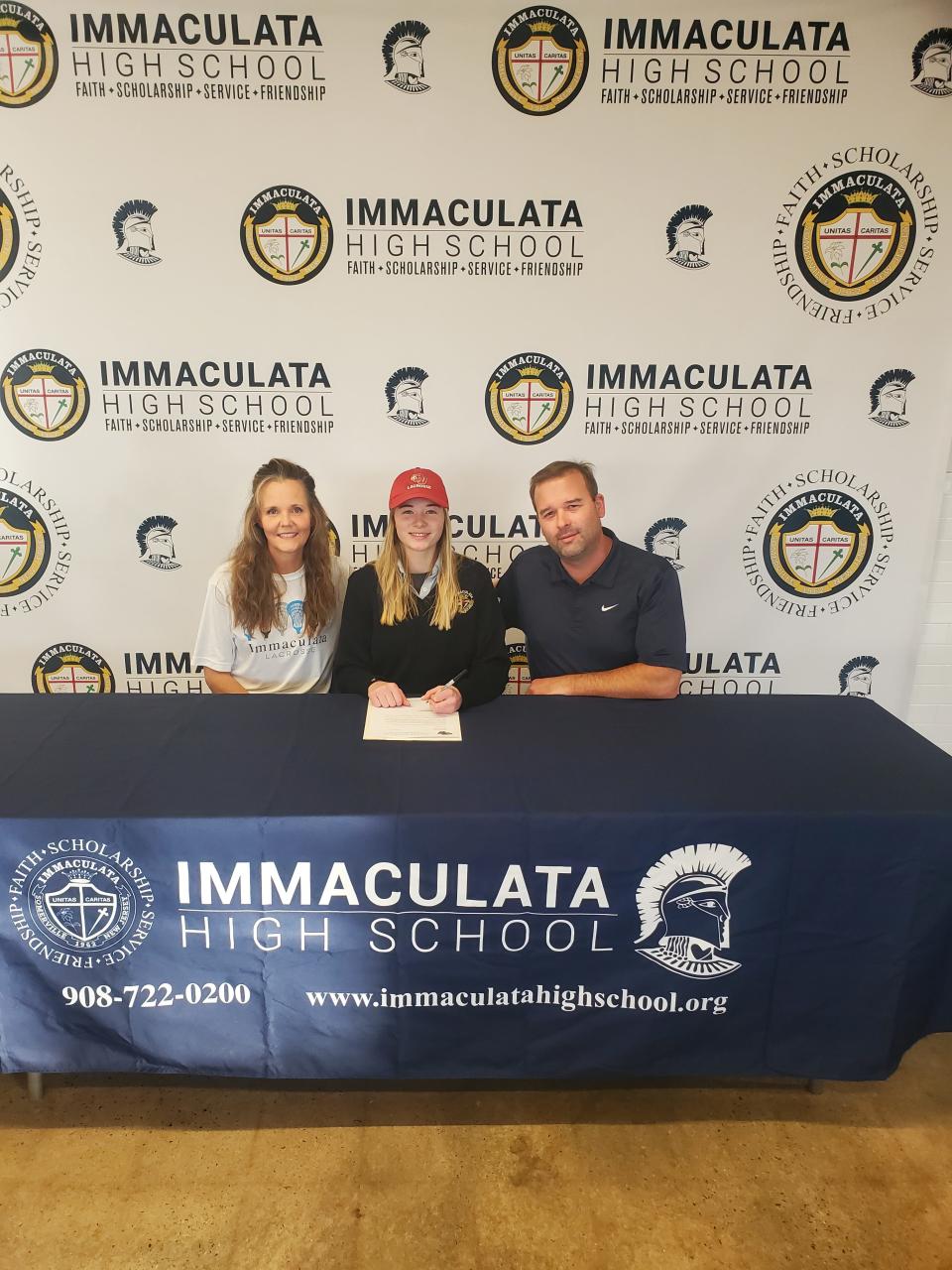 Immaculata's Sarah Kate Schneider signs her National Letter of Intent to play lacrosse at Caldwell University on Wednesday, Nov. 10, 2021.