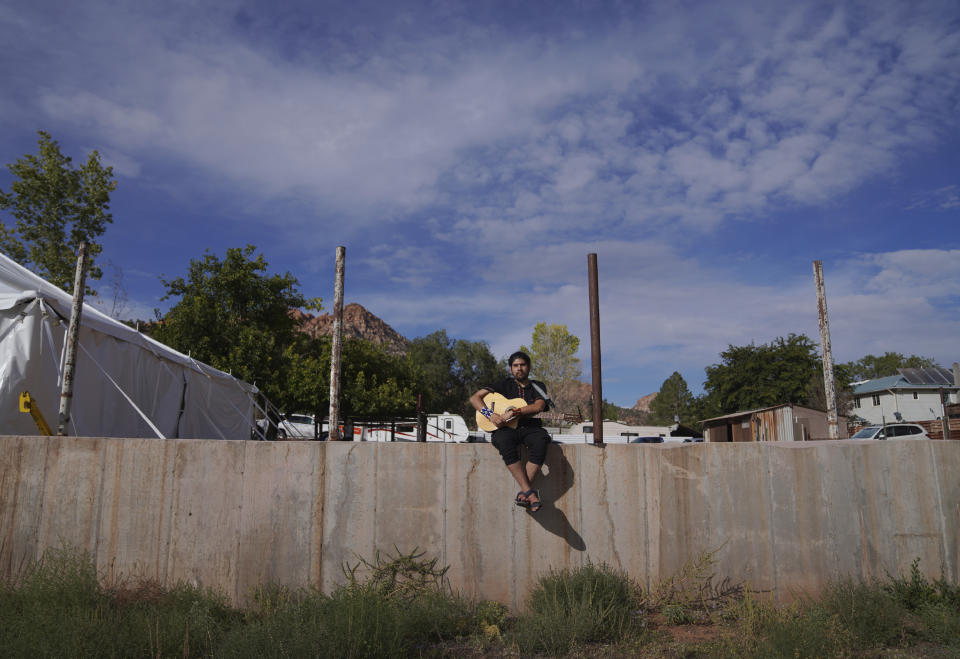 Eloy Delgadillo, musician and facilitator for Hummingbird Church, practices songs for an upcoming ayahuasca ceremony, on Sunday, Oct. 16, 2022, in Hildale, Utah. (AP Photo/Jessie Wardarski)