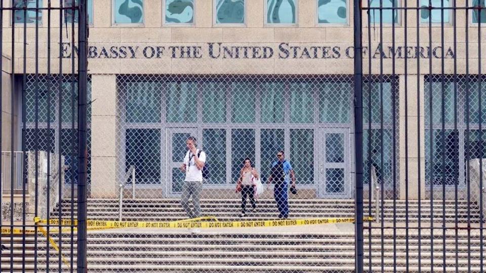 Workers at the U.S. Embassy in Havana leave the building on Sept. 29, 2017, after the State Department announced that it was withdrawing all but essential diplomats from the embassy.