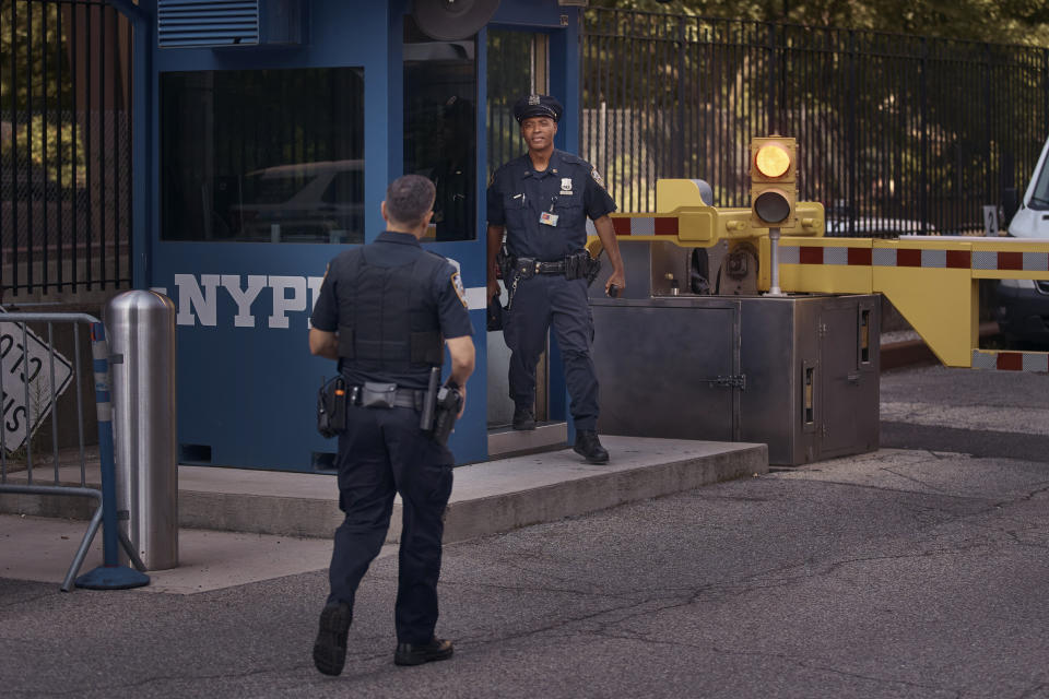 Police officers guard outside One Police Plaza NYPD Headquarters on Friday, Sept. 13, 2024, in New York. (AP Photo/Andres Kudacki)