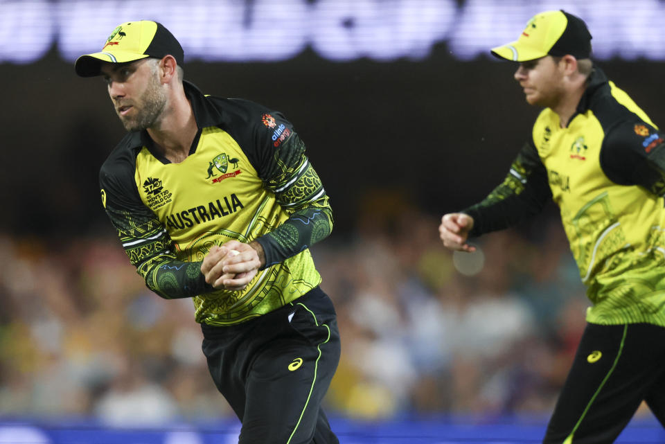 Australia's Glenn Maxwell takes a catch to dismiss Ireland's Gareth Delany during the T20 World Cup cricket match between Australia and Ireland, in Brisbane Australia, Monday, Oct. 31, 2022. (AP Photo/Tertius Pickard)