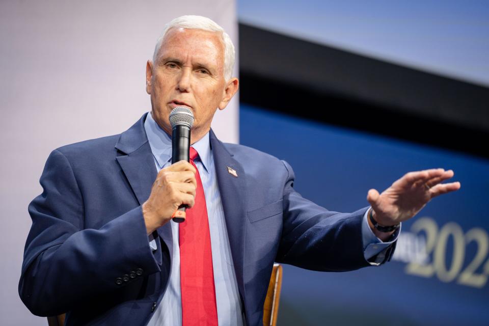 Former Vice President Mike Pence talks with moderator Tucker Carlson, left, during the Family Leadership Summit in Des Moines, Friday, July 14, 2023. 