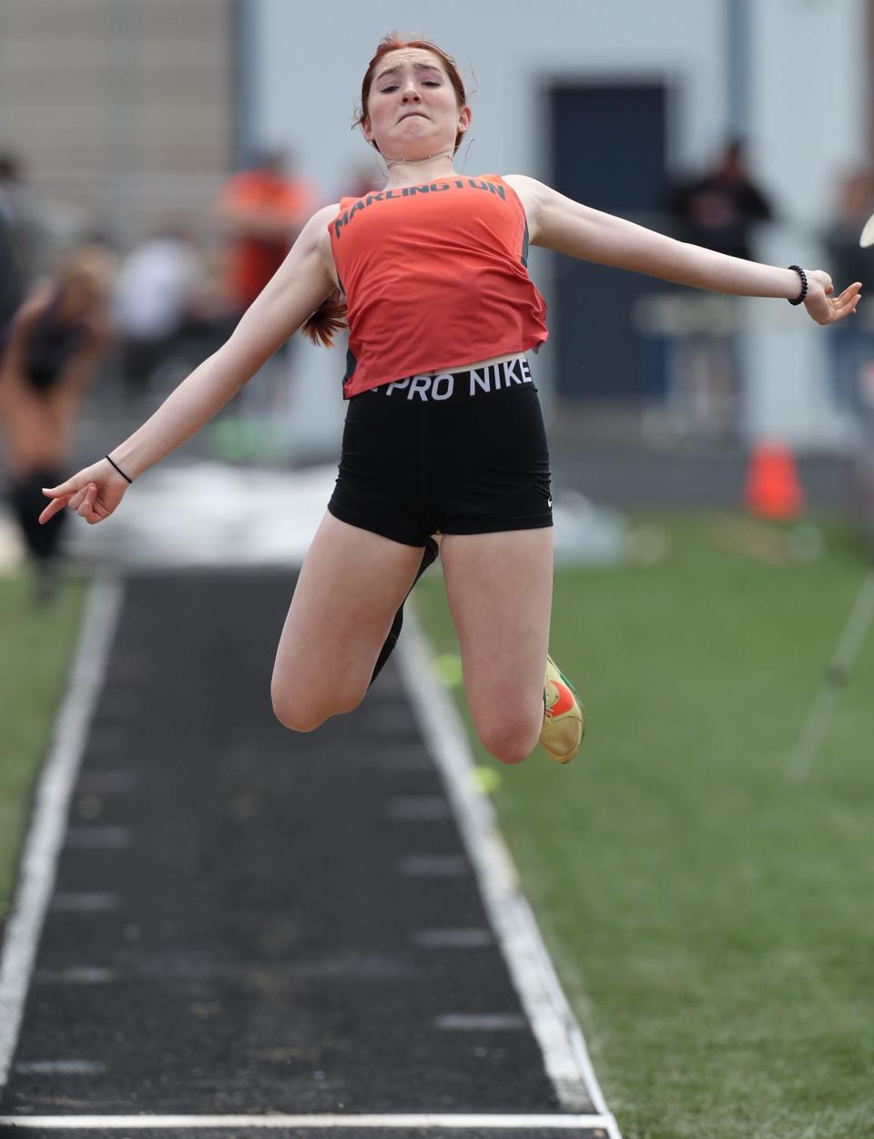 Marlington's Ariana Painter jumps 17 feet in the girls long jump for a second-place finish in the Division II regional meet at Austintown Fitch High School on Saturday, May 28, 2022.