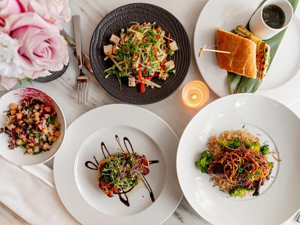 A tray of five plates with some of the gourmet food served at Boram Postpartum Retreat in Manhattan.