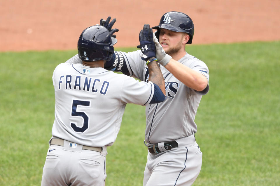 BALTIMORE, MD - AUGUST 29:  Austin Meadows #17 of the Tampa Bay Rays celebrates hitting a two-run home run with teammate Wander Franco #5 in the sixth inning with Wander Franco #5 during a baseball game against the Baltimore Orioles at Oriole Park at Camden Yards on August 29, 2021 in Baltimore, Maryland.  (Photo by Mitchell Layton/Getty Images)