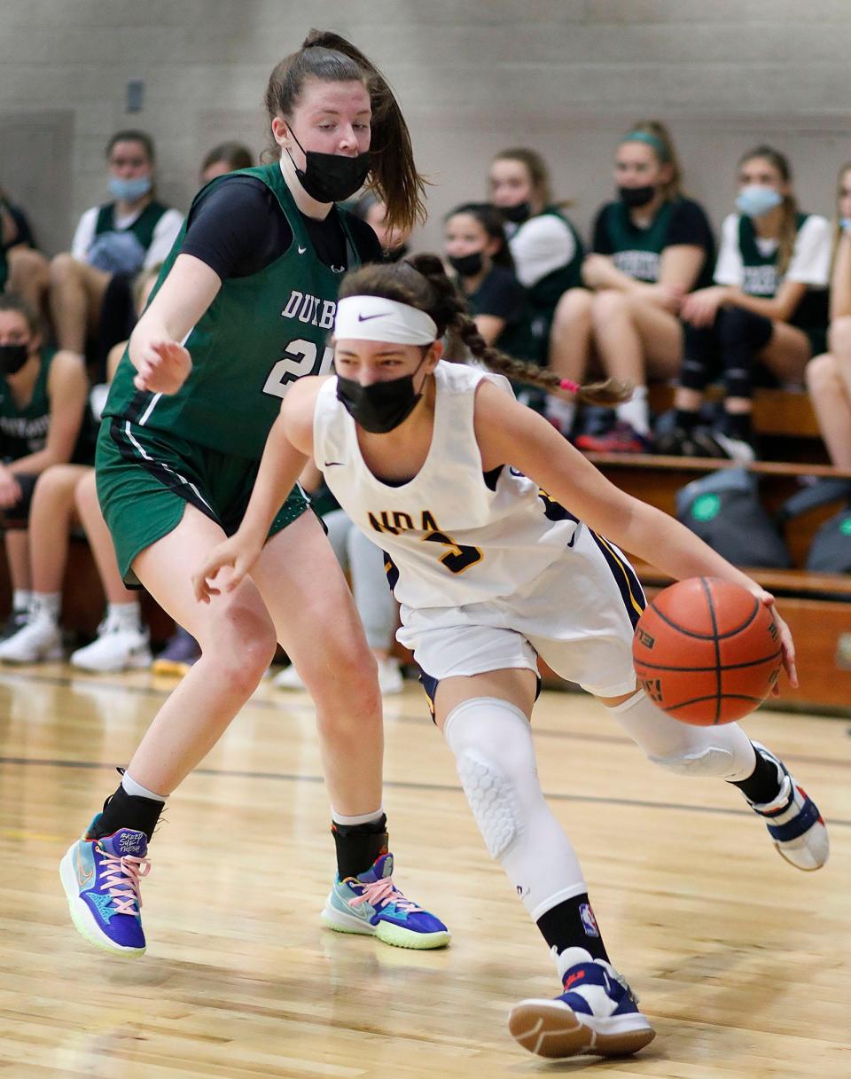 Duxbury's Molly Donovan tries to box out NDA's Elle Orlando. Notre Dame Academy hosts Duxbury girls basketball on Friday, Dec. 10, 2021.