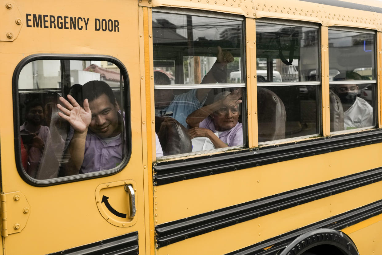 FILE - Nicaraguan citizens wave from a bus after being released from a Nicaraguan jail and landing at the airport in Guatemala City, Sept. 5, 2024. (AP Photo/Moises Castillo, File)