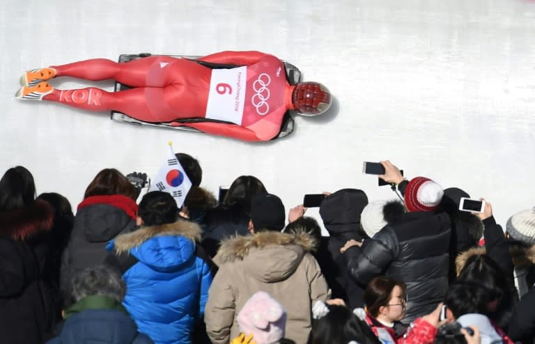 South Korea's Yun Sungbin speeds towards the gold medal watched by an army of fans in the men's skeleton during the Pyeongchang 2018 Winter Olympics on Friday