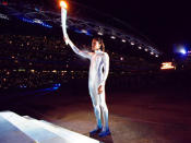 <p>Torchbearer Cathy Freeman of Australia prepares to light the Olympic Flame during the Opening Ceremony of the Sydney 2000 Olympic Games.</p>