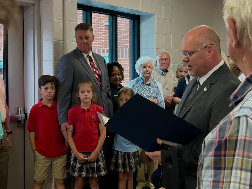 Madison Co. Sheriff's Office Director of Operations Jeff Wall reads a proclamation to Cornelia Tiller from the City Mayor Scott Conger and Madison County Mayor AJ Massey that declares May 16, 2023 as "Cornelia Tiller Day" in Jackson.
