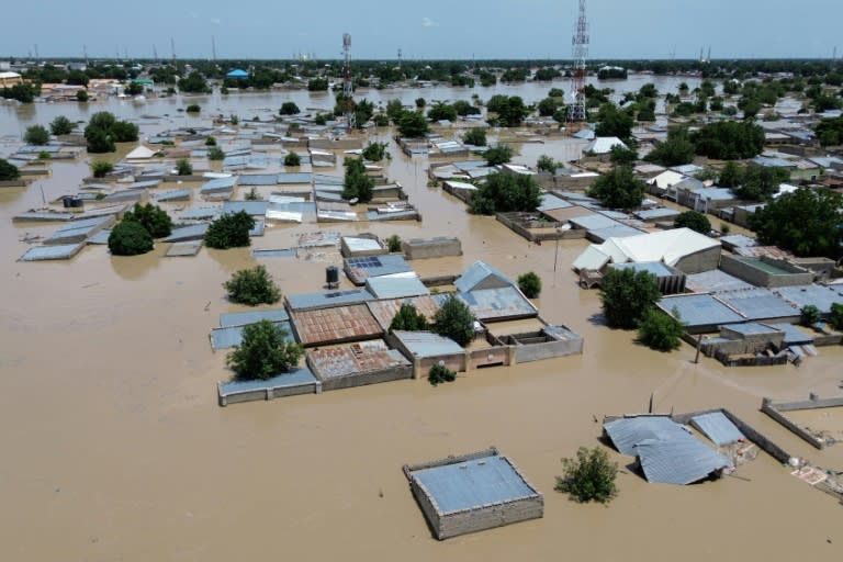 An aerial view shows houses submerged under water in Maiduguri, also facing a jihadist insurgency (Audu MARTE)