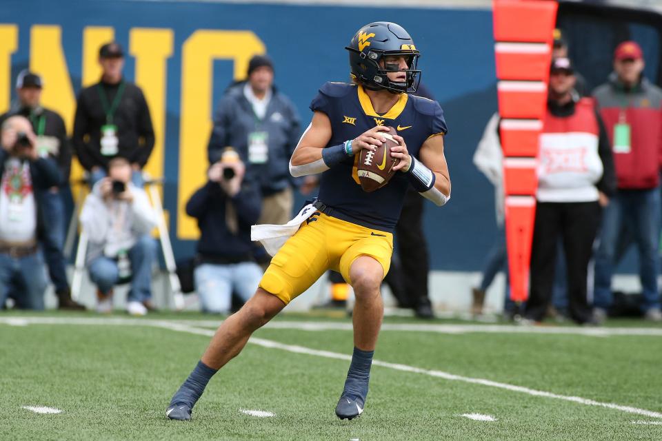 West Virginia quarterback Garrett Greene (6) passes during the first half of an NCAA college football game against Iowa State in Morgantown, W.Va., Saturday, Oct. 30, 2021. (AP Photo/Kathleen Batten)