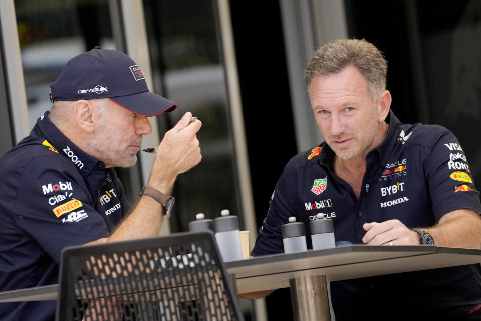 Red Bull team principal Christian Horner, right, has breakfast with Red Bull lead designer Adrian Newey prior to the first practice session ahead of the Formula One Bahrain Grand Prix at the Bahrain International Circuit in Sakhir, Bahrain, Thursday, Feb. 29, 2024. (AP Photo/Darko Bandic)