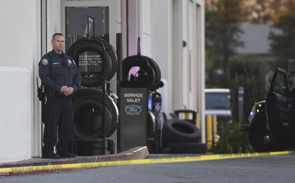 Police investigate at the scene of a shooting at the Morgan Hill Ford Store in Morgan Hill, Calif., Tuesday, June 25, 2019. Police say at least three people were shot including the suspect in what may be a workplace confrontation. (AP Photo/Nic Coury)