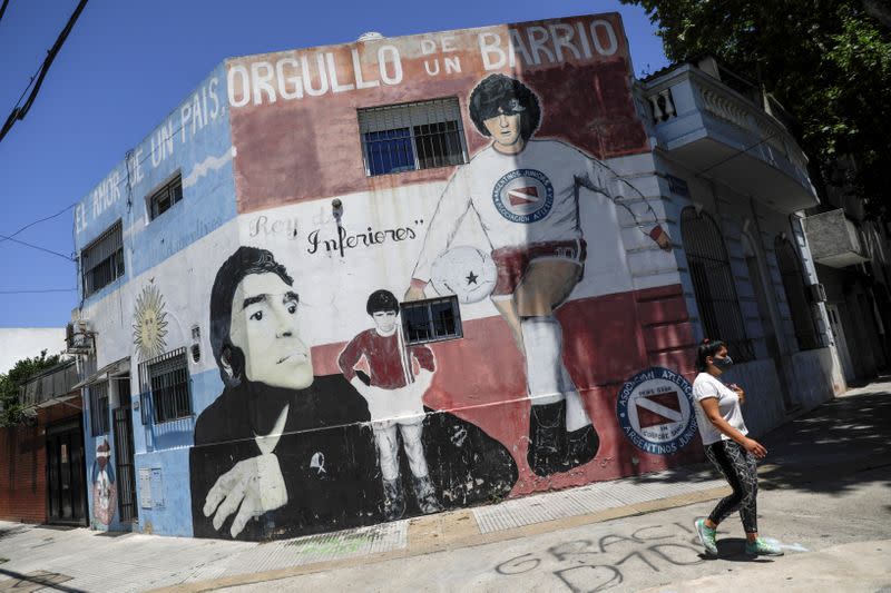 FILE PHOTO: People mourn the death of soccer legend Diego Armando Maradona, in Buenos Aires