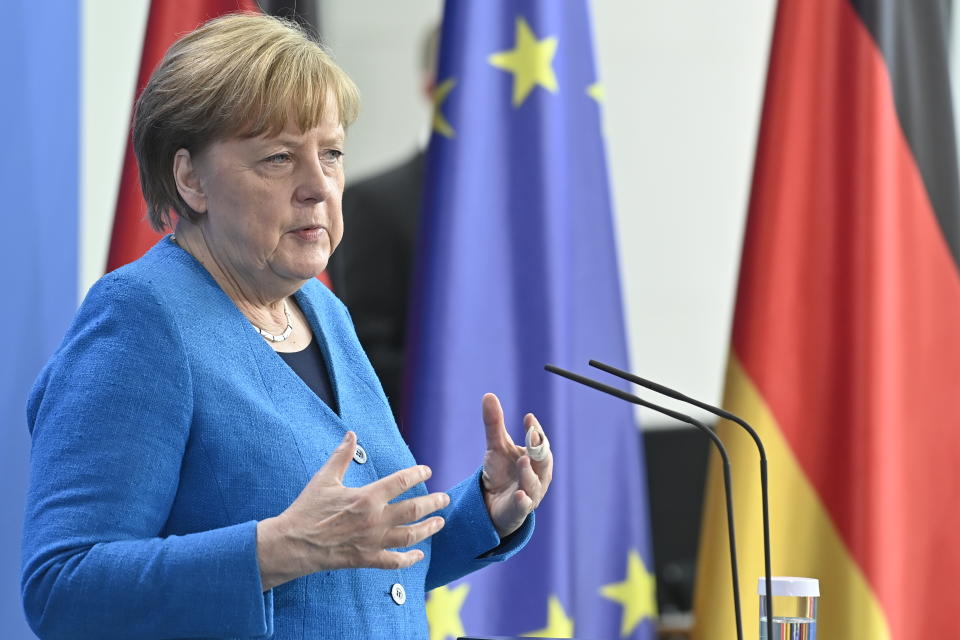 German Chancellor Angela Merkel attends a press conference after the informal EU summit and the EU-China summit in Berlin, Germany, Saturday, May 8, 2021. Merkel reiterated her stance that the shortage of vaccines worldwide would not be solved by a waiver of patents, as suggested by U.S. President Biden. (John MacDougall/Pool Photo via AP)