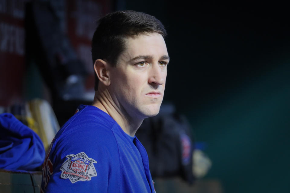 Chicago Cubs starting pitcher Kyle Hendricks sits in the dugout during the eighth inning of the team's baseball game against the Cincinnati Reds, Tuesday, May 14, 2019, in Cincinnati. (AP Photo/John Minchillo)