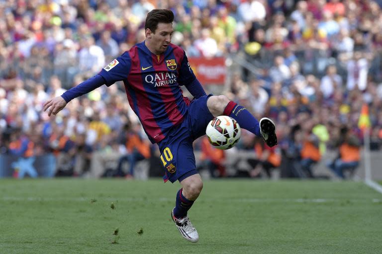 Barcelona's Argentinian forward Lionel Messi controls a ball during the Spanish league football match FC Barcelona v Valencia CFat the Camp Nou stadium in Barcelona on April 18, 2015