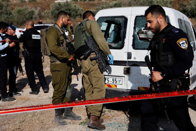 Israeli troops inspect shooting attack scene near Nablus, in the Israeli-occupied West Bank