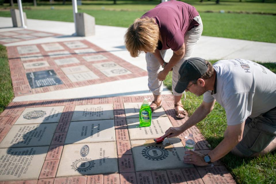 The Michigan WWll Legacy Memorial board of directors Judy Maten, 65, of Royal Oak, left and Russell Levine, 62, of Huntington Woods, work on putting on phase 1 finishing touches on Wednesday, Aug. 9, 2023, at Memorial Park in Royal Oak for the memorial dedication that will take place between 4-6 pm on Thursday, Aug. `10, 2023. Fishman will be a guest of honor at the dedication.