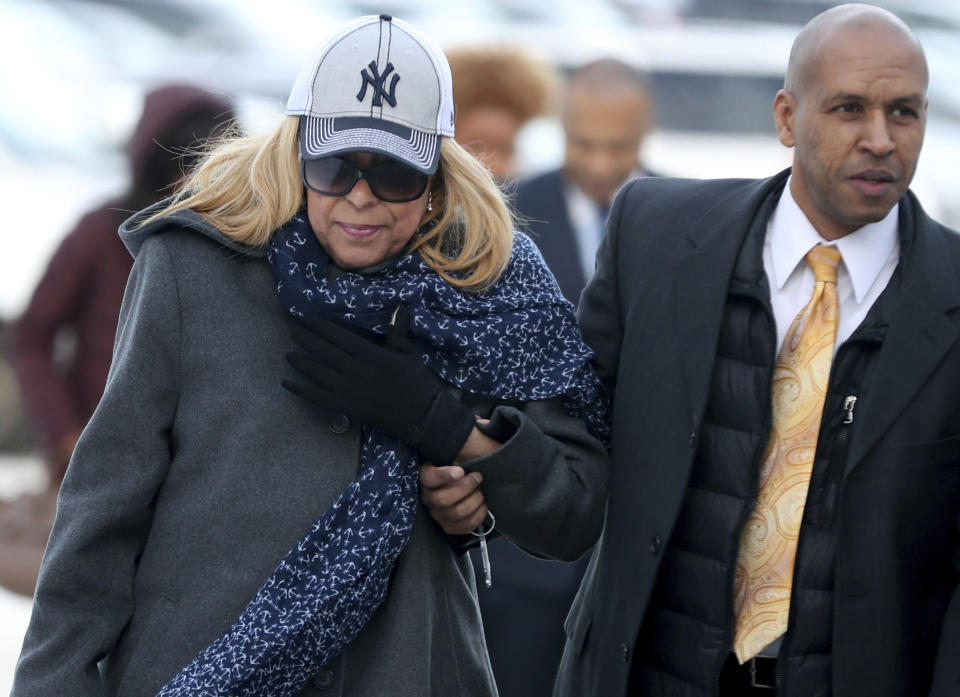 Prince's half-sister Sharon Nelson, left, center, arrives at the Carver County Justice Center for a hearing on her brother's estate Thursday, Jan. 12, 2017, in Chaska, Minn. All the siblings want the judge to declare the trust company Comerica as a "personal representative," or executor, of the estate. But they're divided on whether to name anyone as co-executor. Four of the six siblings back longtime Prince lawyer L. Londell McMillan. But Tyka Nelson and Omar Baker object. (David Joles/Star Tribune via AP)