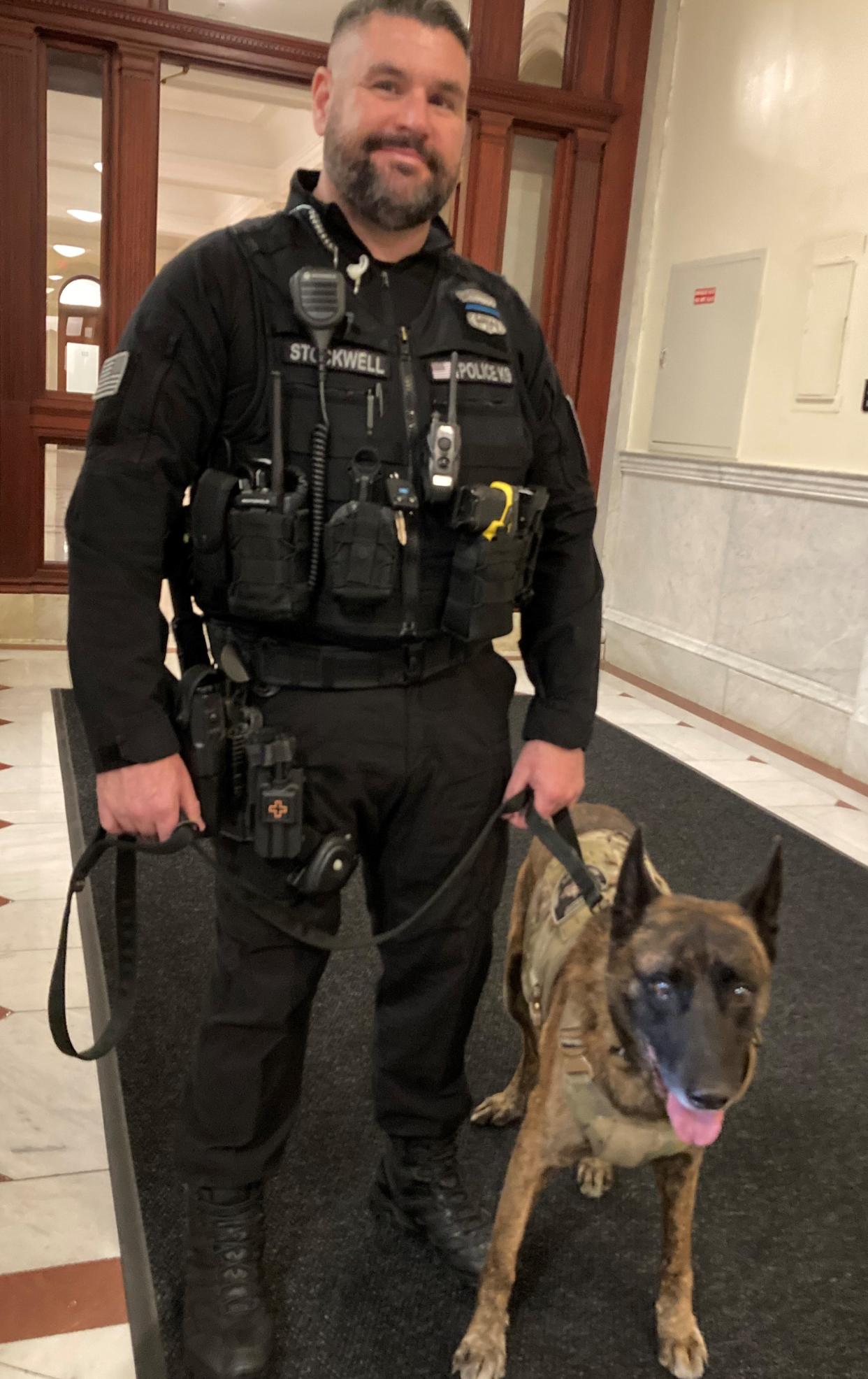 Uxbridge Officer Tom Stockwell, with his partner, Bear, testified before the Joint Committee on Public Safety and Homeland Security Monday, about establishing the right to offer advanced life support medical treatment for injured police dogs.
