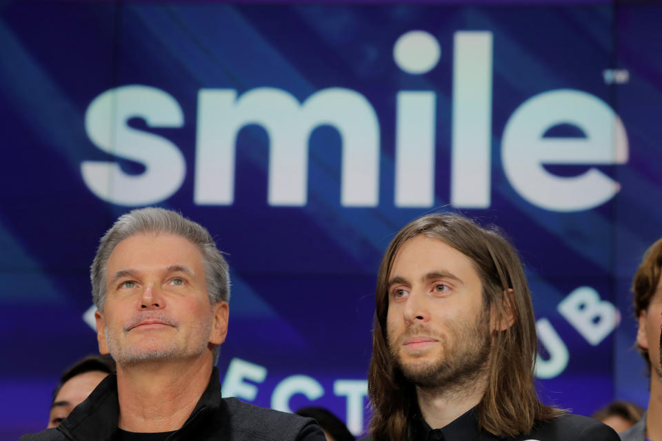 David Katzman, CEO of SmileDirectClub stands with founder Jordan Katzman as the company debuts its IPO at the Nasdaq MarketSite in New York, U.S. September 12, 2019. REUTERS/Lucas Jackson