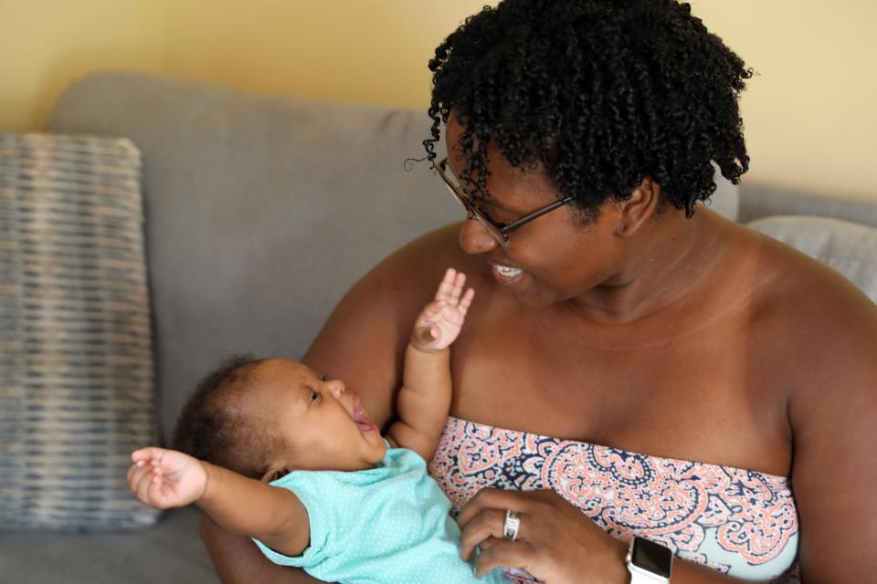 Meredith LeJeune, 37, enjoys time with her three-month old daughter Mecca at home in Garnerville July 16, 2020. LeJeune, also a mother of twins, said her experience with her first pregnancy with a Black doctor was much warmer and comforting than her second experience with a white doctor, which felt more sterile. She said she is considering becoming a doula herself to advocate for other women. 