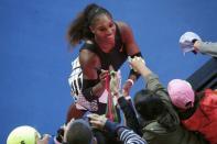 Tennis - Australian Open - Melbourne Park, Melbourne, Australia - 26/1/17 Serena Williams of the U.S. signs autographs after winning her Women's singles semi-final match against Croatia's Mirjana Lucic-Baroni. REUTERS/Jason Reed