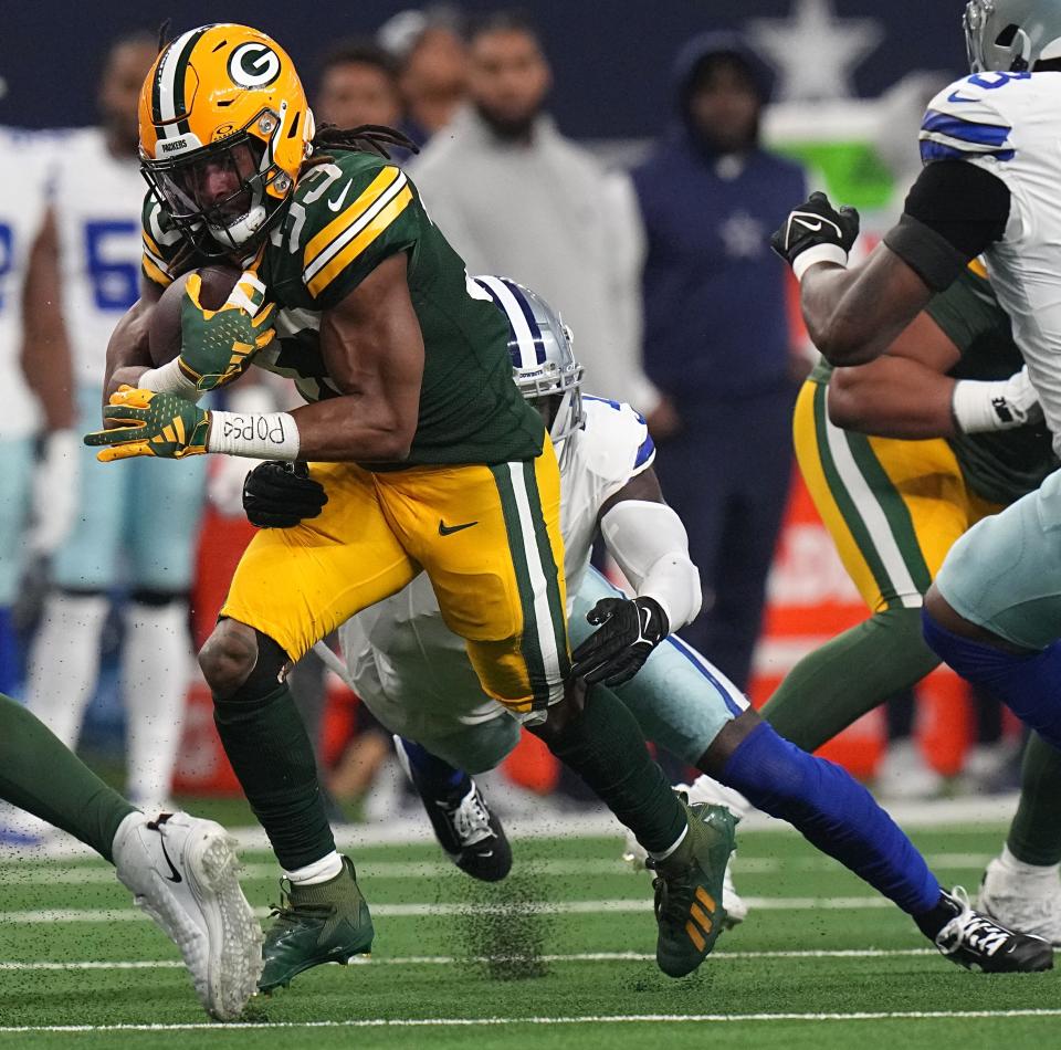 Aaron Jones rushed for 118 yards on 21 carries and tied a Packers playoff record with three rushing touchdowns in Green Bay's 48-32 win over the Cowboys on Sunday at AT&T Stadium.