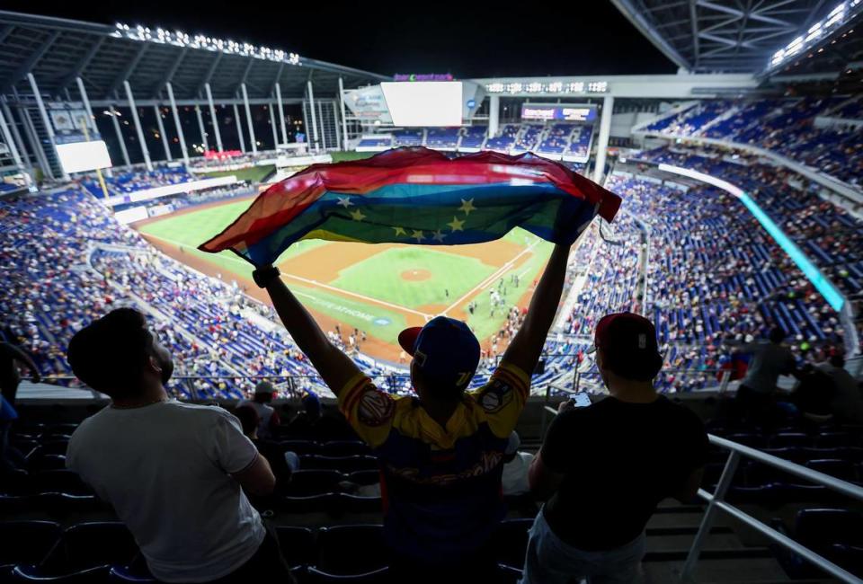 Venezuela fans watch as their team prepares to play against Dominican Republic during their Caribbean Series baseball championship game at loanDepot park on Friday, Feb. 9, 2024, in Miami, Fla.