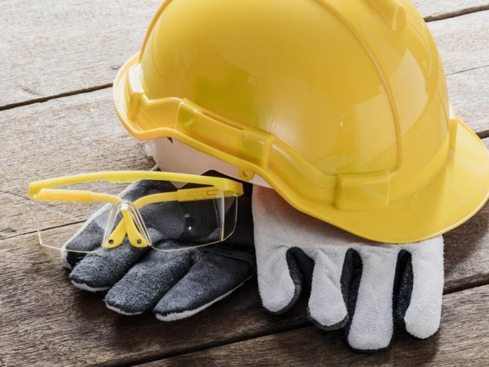 A hard hat, work gloves and safety glasses are seen in this stock photo. A stop-work order has been issued at a construction site in Dartmouth after 2 men fell from scaffolding Monday. (Shutterstock / sirastock - image credit)