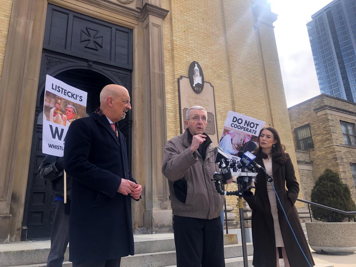 The Rev. James Connell, a retired priest who previously led two Sheboygan parishes, speaks outside the Cathedral of St. John the Evangelist on Friday, March 24 in Milwaukee after Archbishop Jerome Listecki barred him from hearing confessions. Peter Isely, director of the anti-clergy abuse group Nate's Mission, is to the left.