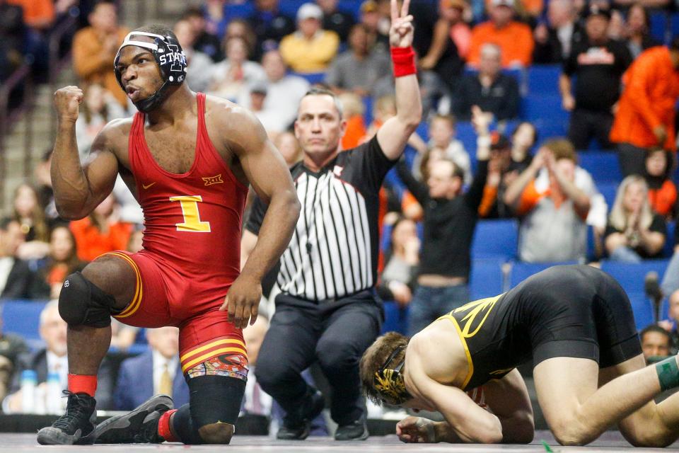 Iowa State's Paniro Johnson celebrates after defeating Missouri's Brock Mauller during the championship round of the Big 12 Championships on March 5 in Tulsa, Okla.