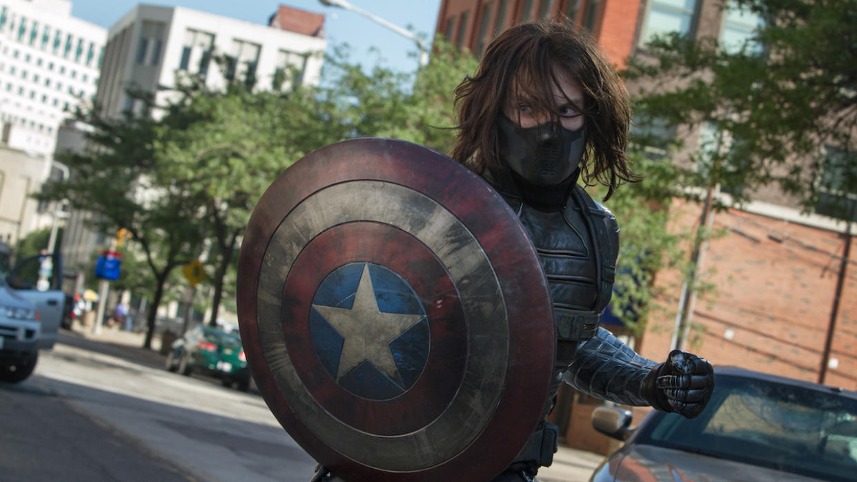  Masked Bucky Barnes as Winter Soldier holding Captain America's shield. 