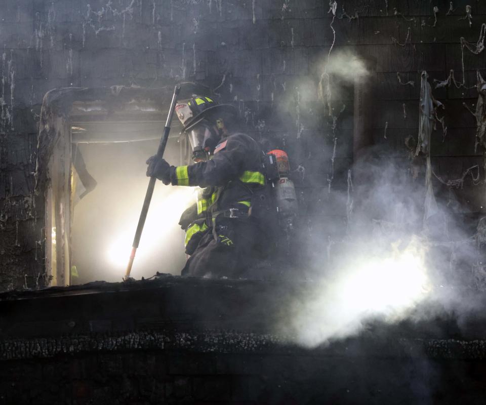 Whitman firefighters and other fire departments battle a two-alarm house fire at 137 West St. on Thursday, Sept. 15, 2022.