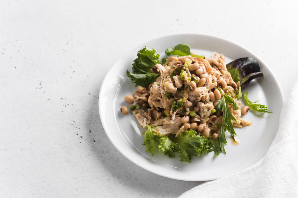 This image released by Milk Street shows a recipe for Chicken and Bean Salad with Pepper Jelly Vinaigrette. (Milk Street via AP)