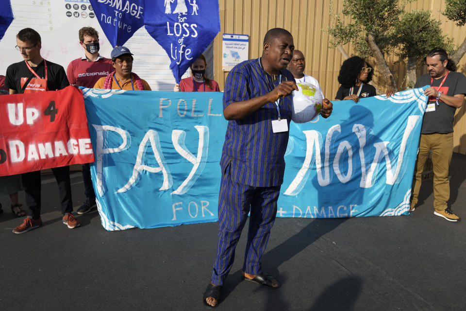 Demonstrators demand pay for loss and damage at the COP27 U.N. Climate Summit, Wednesday, Nov. 16, 2022, in Sharm el-Sheikh, Egypt. (AP Photo/Peter Dejong)