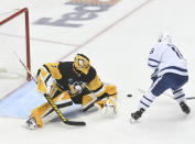 Right wing Mitchell Marner scores on Pittsburgh Penguins goalie Casey DeSmith during the first period of an NHL hockey game, Saturday, Nov. 26, 2022, in Pittsburgh. (AP Photo/Philip G. Pavely)