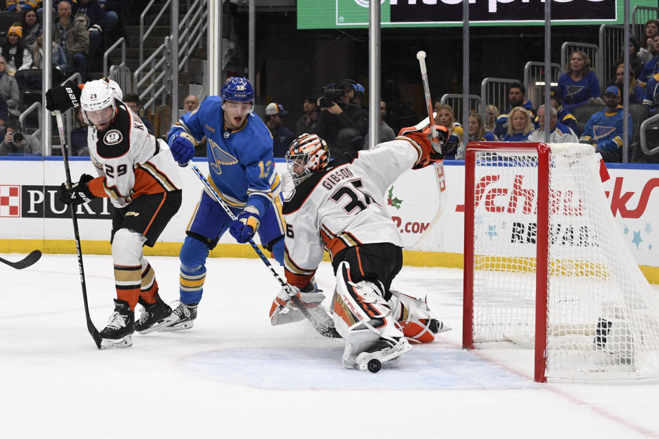 Anaheim Ducks goaltender John Gibson (36) eyes the puck against St. Louis Blues' Alexey Toropchenko (13) during the second period of an NHL hockey game, Saturday, Nov. 19, 2022, in St. Louis. (AP Photo/Jeff Le)