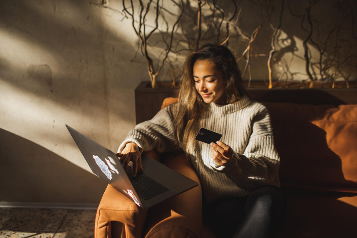 amazon prime day, Young hispanic woman using computer and credit card to manage online banking. Pretty girl shopping online. Online shopping makes life easier. Convenient contactless payment. Making payment online in internet.