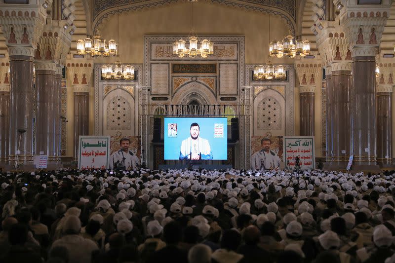 Houthi leader Abdul-Malik al-Houthi addresses followers via a video link in Sanaa