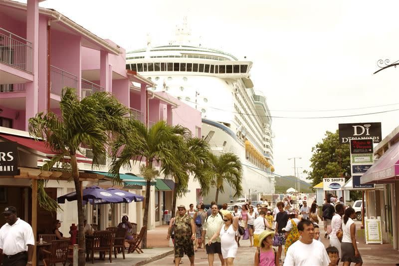 Cruise ship passengers browse the streets of Heritage Quay in St. John's, Antigua.