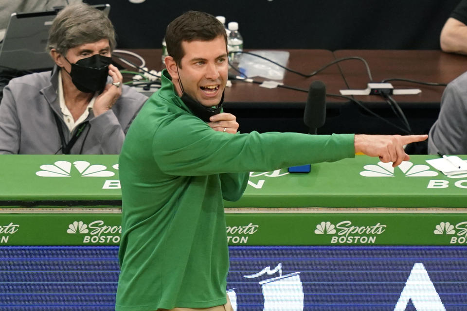 Boston Celtics head coach Brad Stevens instructs his players in the fourth quarter of an NBA basketball game against the Minnesota Timberwolves, Friday, April 9, 2021, in Boston. (AP Photo/Elise Amendola)