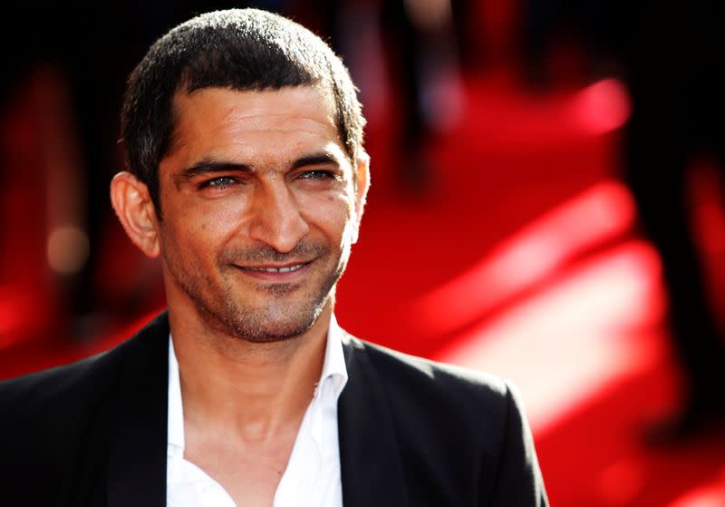 FILE PHOTO: Actor Amr Waked arrives for the European premiere of "Salmon Fishing in the Yemen" at the Odeon Kensington in London